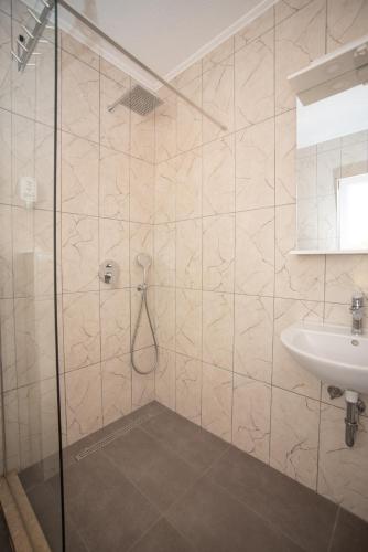 a bathroom with a shower and a sink at NACIONAL in Trebinje