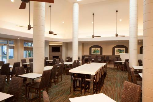 an empty dining room with tables and chairs at Residence Inn Orlando Lake Buena Vista in Orlando