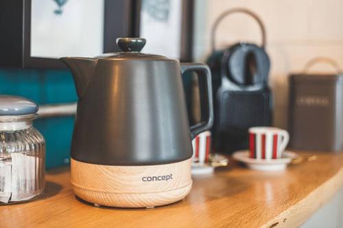 a coffee pot sitting on top of a counter at The Old Shop, Studio Hideout, Stoke Fleming in Stoke Fleming