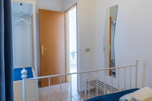 a room with a staircase with a door and a bed at Villa Arianna in Ragusa