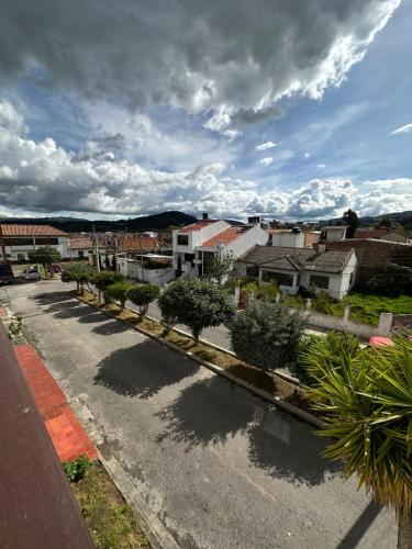 an aerial view of a street with houses and trees at Hotel Rook INN in Paipa