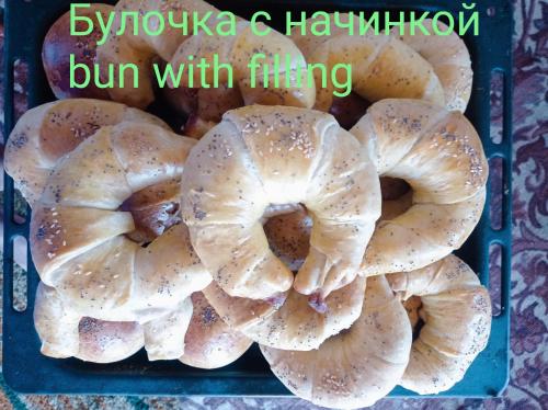 a bunch of bagels in a blue bin with the words bump with flipping at Аruu_guesthouse 