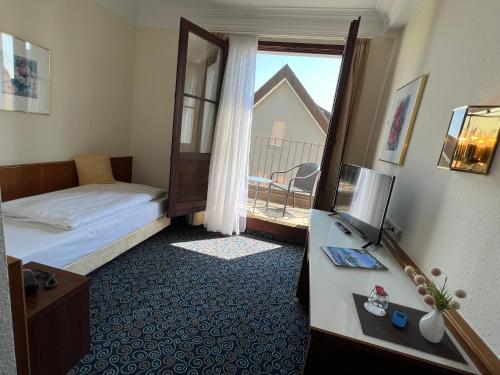 Postel nebo postele na pokoji v ubytování Stadthotel