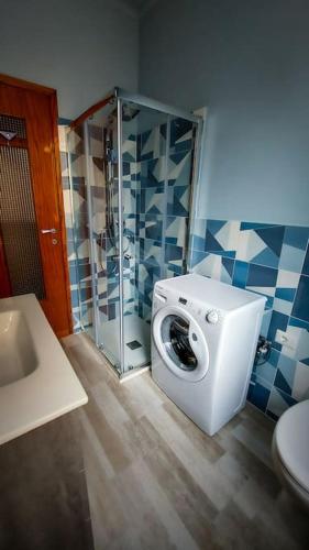 a bathroom with a toilet and a glass shower at Alloggio Rumore di Onde in Rapallo
