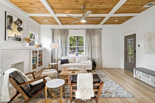 a living room with a couch and a table at Urban Elegance Retreat in San Antonio