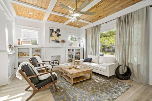 a living room with a couch and a table at Urban Elegance Retreat in San Antonio