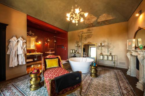 a large bathroom with a large tub and a sink at Relais Le Due Matote in Bossolasco