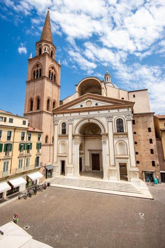 a large building with a tower and a church at CasaLonghi in Mantova