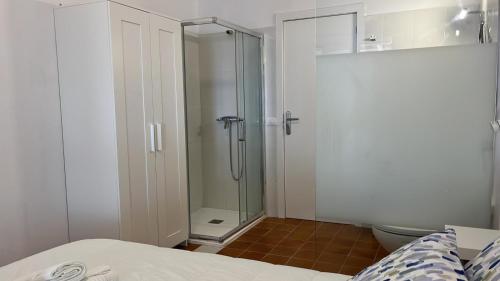 a bathroom with a shower and a toilet at Boutique Hotel Las Eras Beach in Las Eras