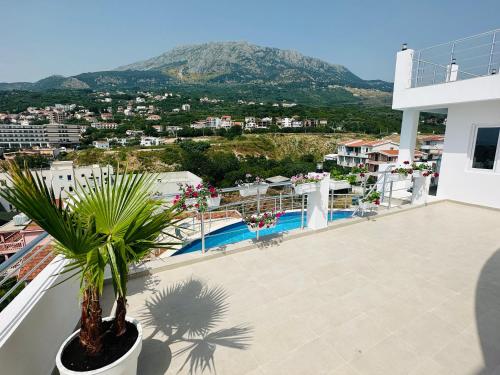a balcony with a view of a mountain at Apartmani Sunce in Bar