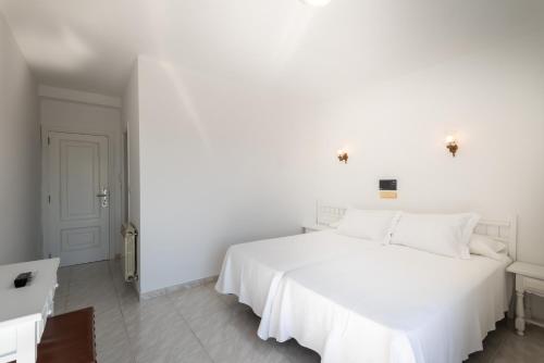 Cama o camas de una habitación en Hotel Ton