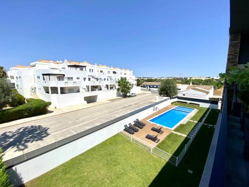 a view of a swimming pool from a building at Tavira Grand Balcony With Pool by Homing in Tavira