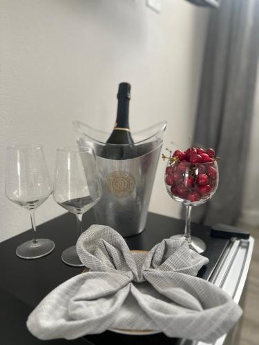 a table with a bottle of wine and two glasses at Villa INN in Villaperuccio