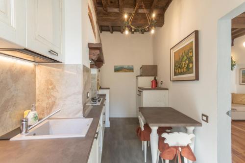 a kitchen with a sink and a counter at Boutique Ponte Vecchio in Florence