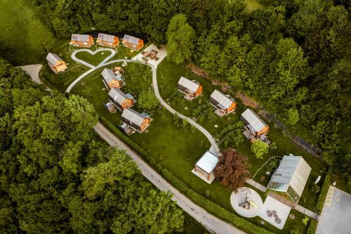 an overhead view of a farm with houses and a road at Glamping Mountain Fairy Tale in Bistrica pri Tržiču