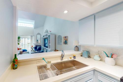 a kitchen with a sink and a living room at Remote Worker Paradise in Los Angeles