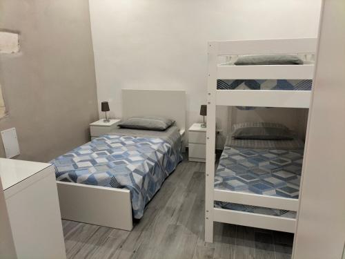 Postel nebo postele na pokoji v ubytování Square House Casa Vacanze