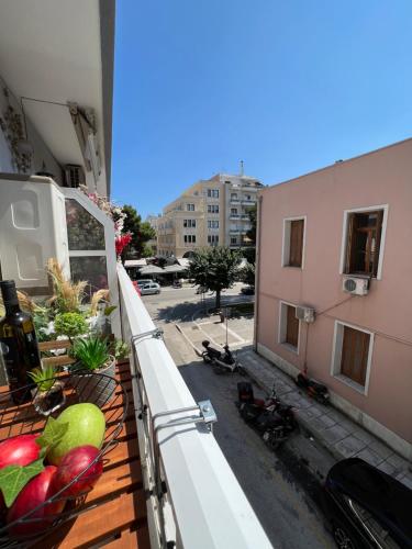 a balcony with fruits and vegetables on a building at Supreme Malibu Suite in Alexandroupoli