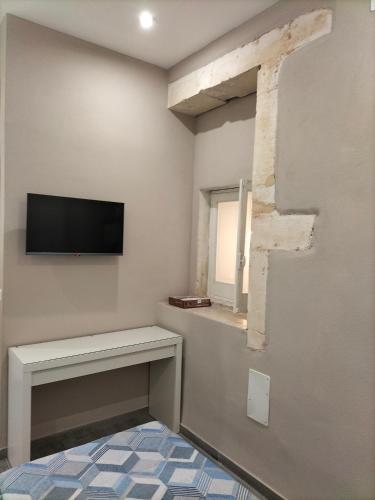 Square House Casa Vacanzeにあるテレビまたはエンターテインメントセンター