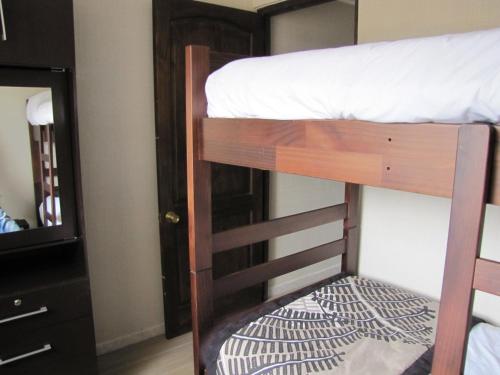 a couple of bunk beds in a room at Apart Hotel Gran Pacifico in La Serena