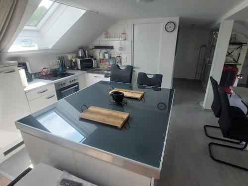 a small kitchen with a table and chairs in it at Apartment Garden-2 by Interhome in Karl