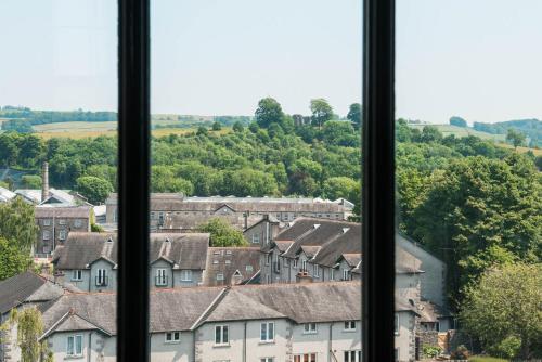 a view of a town from a window at The Arches Apartments Kendal in Kendal