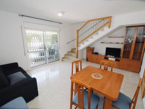 a living room with a table and a couch at Villa Villa Mallorca by Interhome in Miami Platja