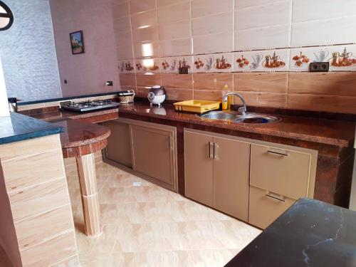 a kitchen with a sink and a counter top at Dream House Sidi Ifni in Sidi Ifni