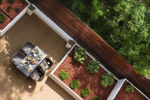 an overhead view of a table and bench on a porch at Bo33 Hotel Family & Suites in Budapest