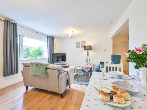 a living room with a couch and a table at Apartment Edyvean by Interhome in Mevagissey