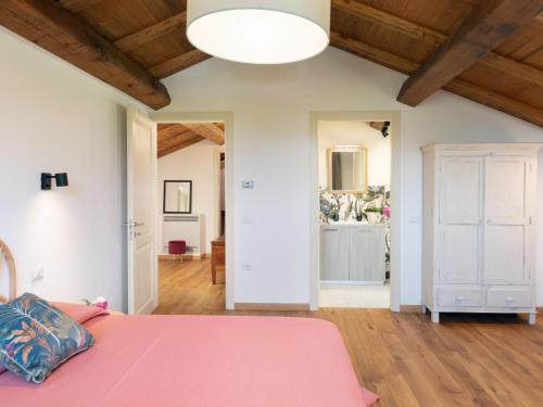 Postel nebo postele na pokoji v ubytování Holiday Home Il Fienile by Interhome