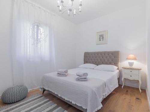 Postel nebo postele na pokoji v ubytování Holiday Home KLM by Interhome