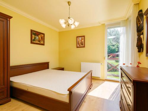 a bedroom with a bed and a window at Apartment Figo by Interhome in Balatonőszöd