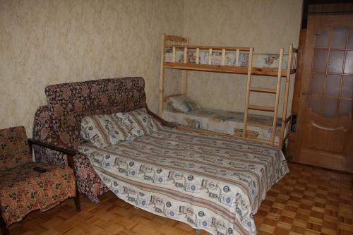 a bedroom with a bed and two bunk beds at Apartment Tiraspol Center in Tiraspol