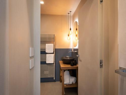 a bathroom with a sink and a mirror and a sink at Holiday Home Casa Maria by Interhome in Spert