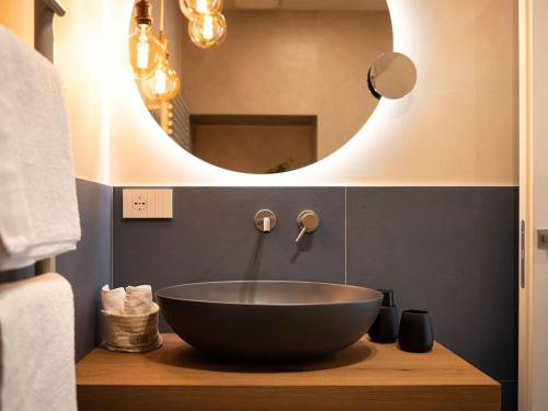 a bathroom with a bowl sink and a mirror at Holiday Home Casa Maria by Interhome in Spert