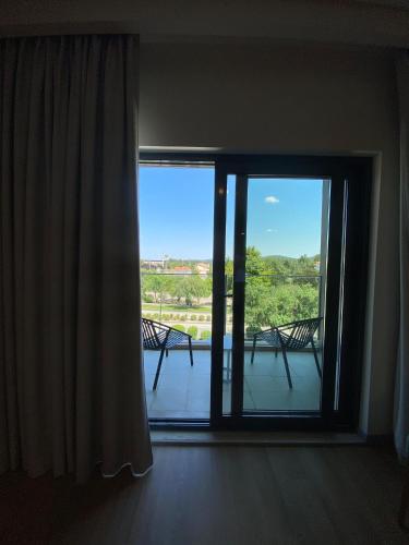 a room with a window with a view of a balcony at Villa Rey Spa & Hotel in Vila de Rei
