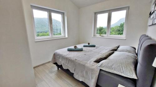 Ένα ή περισσότερα κρεβάτια σε δωμάτιο στο Vinodol Apartments 1 and 2
