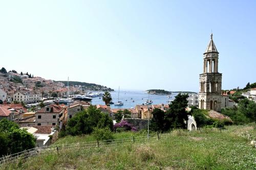 a view of a town with a clock tower at House La Vista Hvar in Hvar