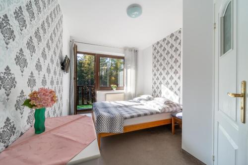 Llit o llits en una habitació de Willa Kaliniec