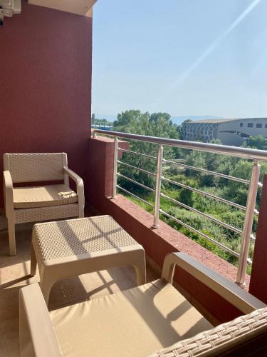 a balcony with a table and chairs and a view at Allure Apartments in Ohrid