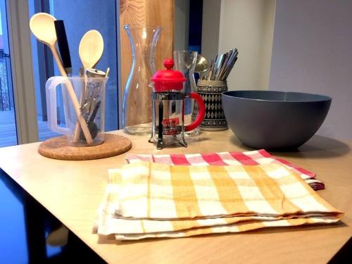 a table with a towel and utensils on a table at Arbio I Lax Apartments in Leipzig