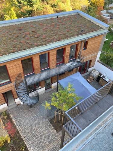 an overhead view of a house with a table and chairs at Arbio I Lax Apartments in Leipzig