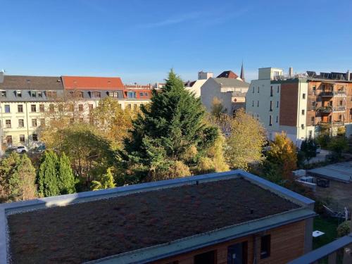 a view of a city with trees and buildings at Arbio I Lax Apartments in Leipzig