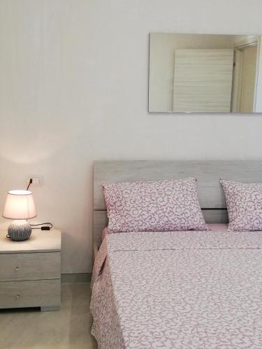 Ένα ή περισσότερα κρεβάτια σε δωμάτιο στο Casa Cinzia diamond 104