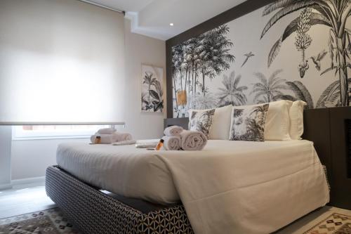 Postel nebo postele na pokoji v ubytování Hermitage Suites