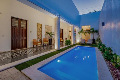 a swimming pool in the backyard of a house at Casona Las Tres Marías - Hotel Only adults in Mérida