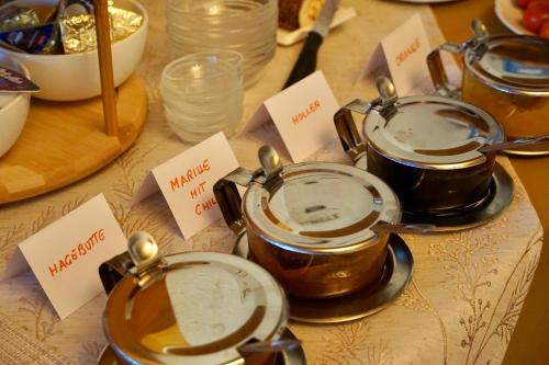 two pots and pans sitting on top of a table at Privatzimmer Haider in Illmitz