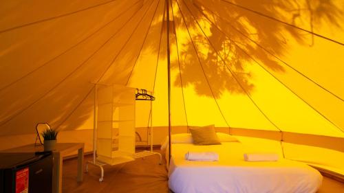 Postel nebo postele na pokoji v ubytování Glamping Atlántico