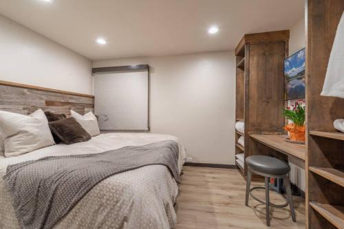 a bedroom with a bed and a chair in it at Northstar Bike Hike Ski In and Out Condo Pools Hot Tubs Courts Walk to Village in Truckee